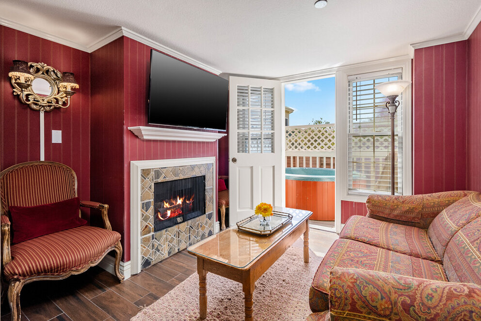 a living room with a fireplace and a couch