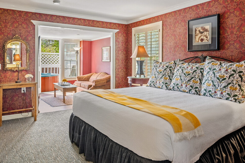 a bedroom with a bed and a couch